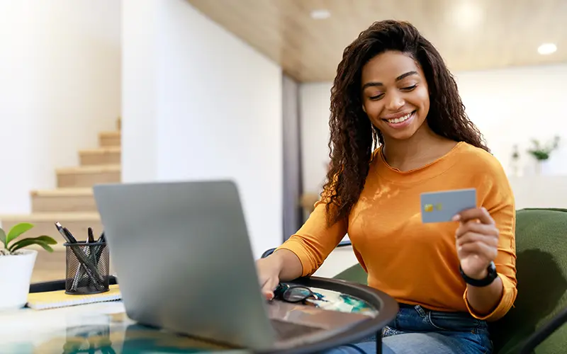 woman holding debit card