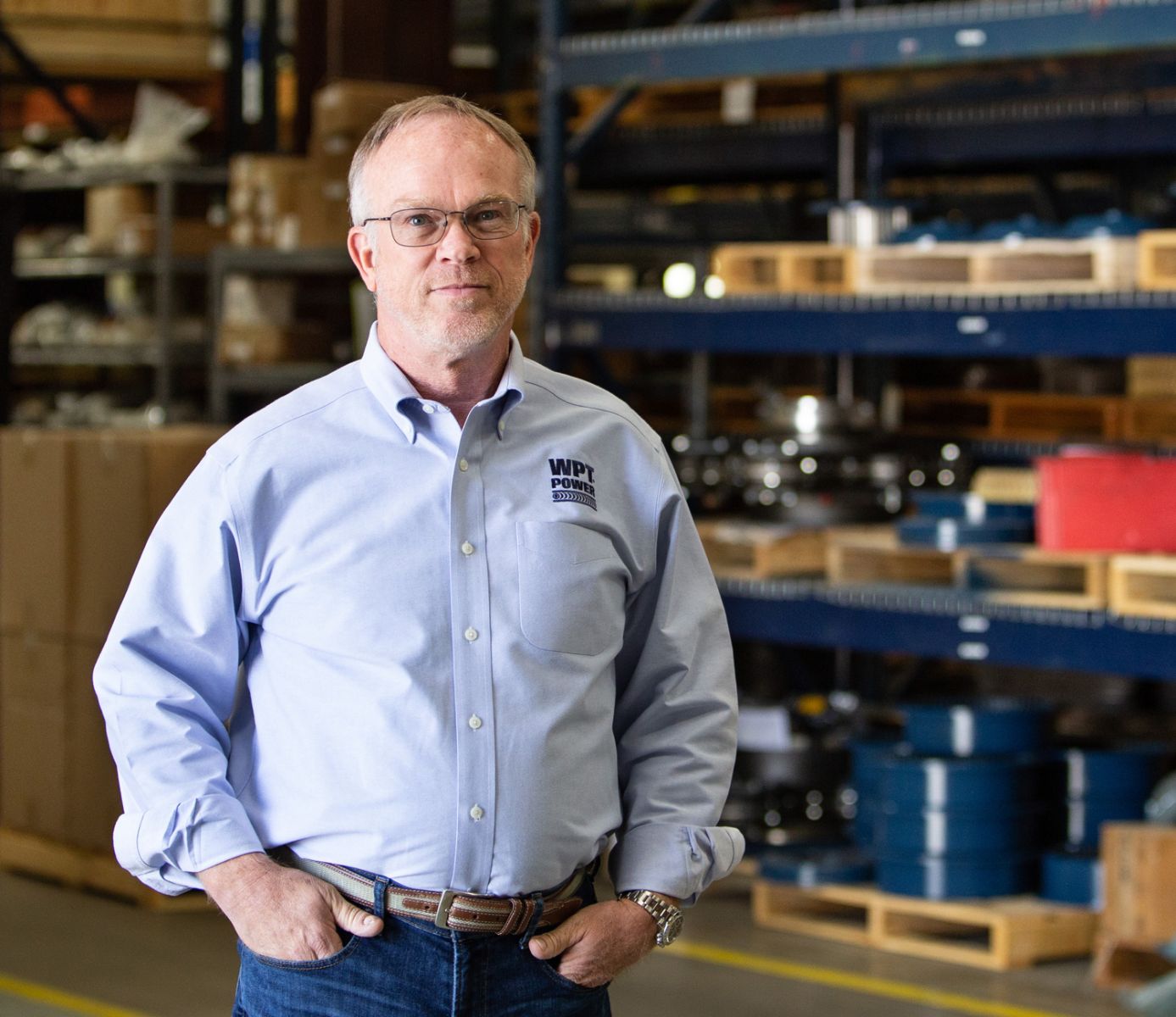 Image of a man standing in a warehouse